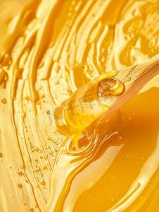 流光字幕摄影照片_一滩黄色的蜂蜜和木棍的特写