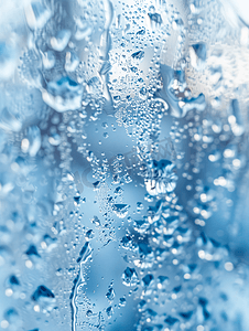 雪树林摄影照片_家窗玻璃上融雪的水滴