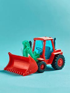 红漆塑料玩具推土机绿色通用刀片绿松石上隔离