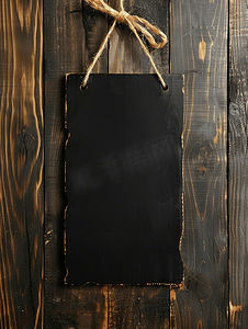 木制菜单摄影照片_木制背景上的黑色空标志板