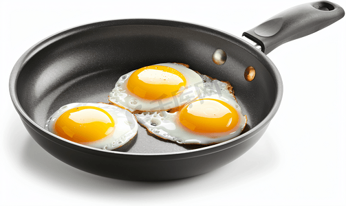 锅中的美食摄影照片_两个煎好的鸡蛋放入煎锅中