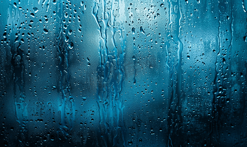 寒露艺术字摄影照片_夜湿窗玻璃的抽象背景带有蓝色调伽马污迹