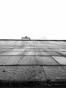 房子扁平摄影照片_屋顶覆盖着现代扁平沥青防水涂层与白色隔离