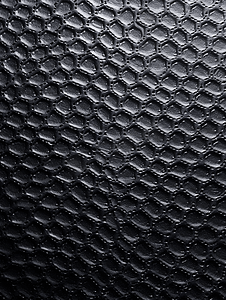 平坦的黑色粗糙塑料或橡胶表面具有装饰性凹凸饰面
