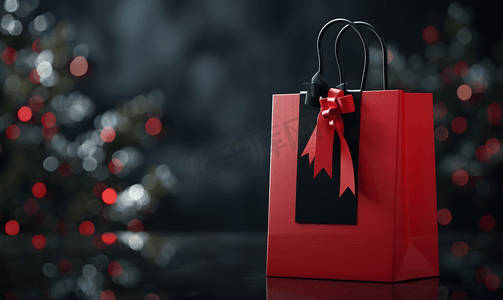 黑色星期五销售概念标签和深色背景中的红色购物袋