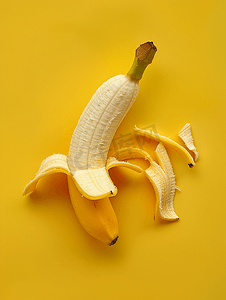 水果水果卡通摄影照片_分离的黄色香蕉皮的上方视图