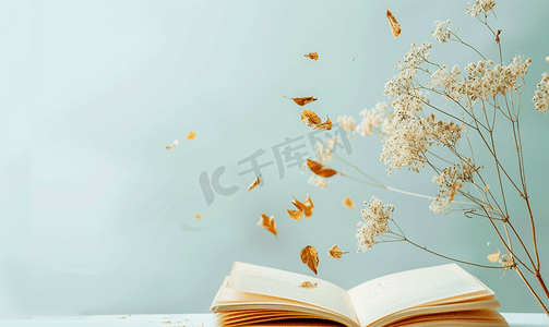 感恩节创意摄影照片_飞扬的干花和树叶的笔记本