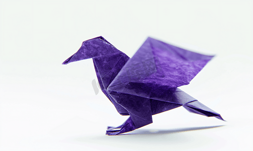 ppt模板折纸课摄影照片_紫色折纸鸟的特写