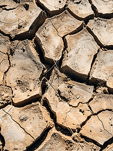 干裂的摄影照片_干旱期间干裂的土壤污垢
