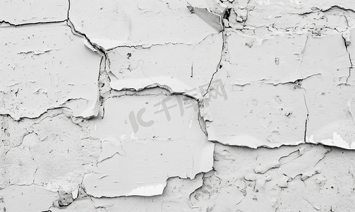 复古分割线波浪摄影照片_白色的混凝土墙已经碎裂露出了砖头