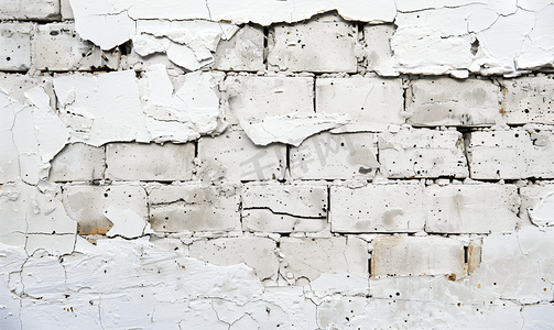 复古分割线波浪摄影照片_白色的混凝土墙已经碎裂露出了砖头