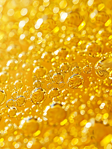 玫瑰金金属条摄影照片_金油气泡关闭水圈宏观抽象闪亮的黄色背景