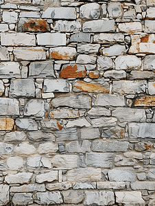 抽象建筑图案摄影照片_瓷砖墙石头制成的栅栏建筑细节