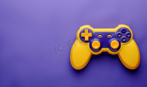 紫色弥散光摄影照片_紫色背景上带有黄色按钮的游戏手柄游戏控制器