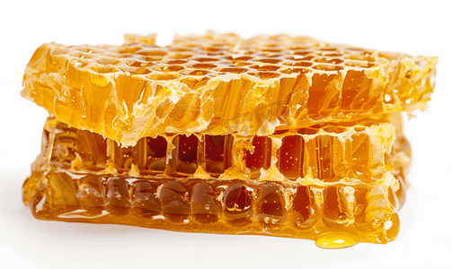 白色背景上的蜂蜜梳甜蜂蜜产品梳子里的甜蜂蜜