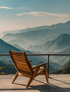 蓝色简约折页摄影照片_阳台上的椅子有山丘背景