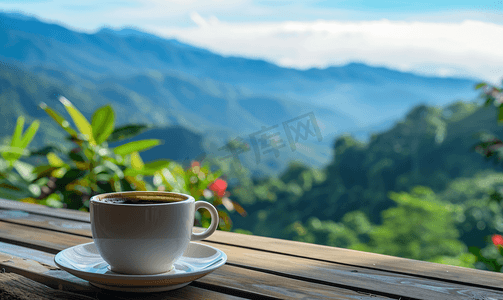 元旦背景喜庆摄影照片_山丘背景木吧台上的黑咖啡