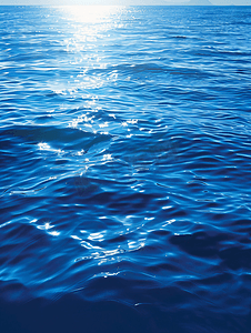 商务光效背景摄影照片_闪亮蓝色水波纹背景海洋背景设计蓝海概念