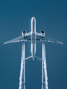 保护大气摄影照片_双引擎飞机在高空飞行时出现凝结尾迹