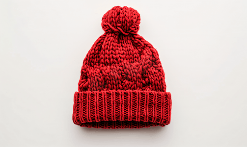 针线活摄影照片_白色背景上孤立的红色冬季针织羊毛帽