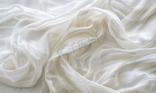 白色织物布纹理美丽皱褶的丝绸或亚麻图案