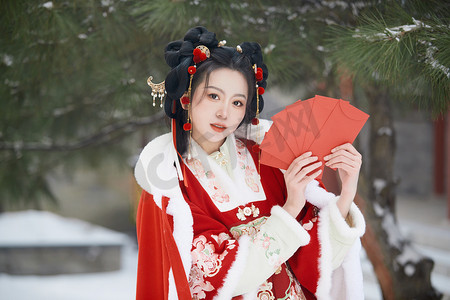 雪天户外身穿中式红色汉服的亚洲少女