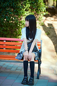 公园小清新摄影照片_穿着日系JK制服的亚洲少女