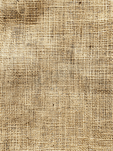 餐巾亚麻毛巾的棕色棉帆布图案纹理浅米色纹理特写顶视图