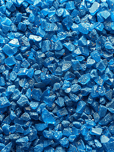 彩色颗粒沙的质地特写蓝色颗粒