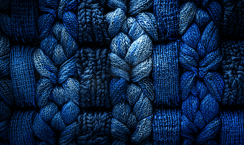 波西米亚编织帆布的天然海军蓝色质感配有柔软风格的蓝绿色羊毛制成的复制空间毛衣