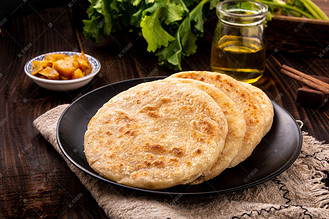 美食白天烧饼盘子摆放摄影图配图