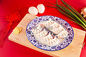 新春节日喜庆美食过年包饺子摄影图配图