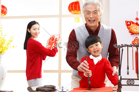 宠物贴纸摄影照片_老年夫妇新年写春联