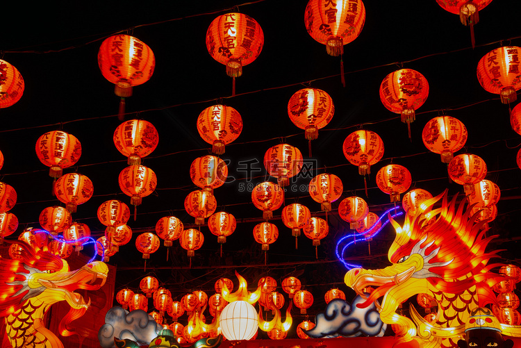 Red lanterns hanging in the black sky and god lamp at night in the