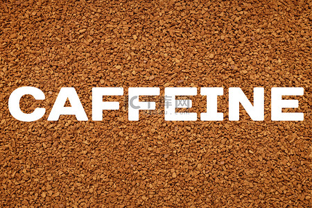 速溶咖啡颗粒背景上的咖啡因文本高清摄影大图 千库网