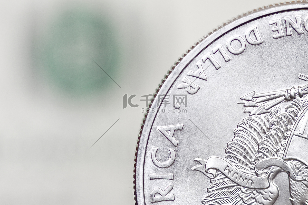银色一美元硬币高清摄影大图-千库网