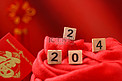 春节白天2024红色背景摆放摄影图配图