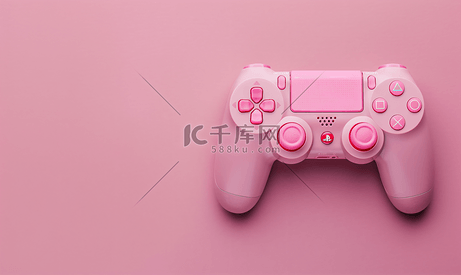 粉红色背景上的游戏控制器游戏手柄带有控制和控制游戏的设备