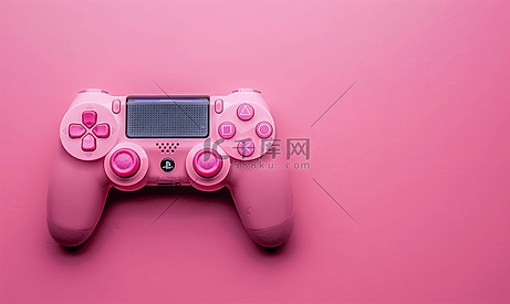 粉红色背景上的游戏控制器游戏手柄带有控制和控制游戏的设备