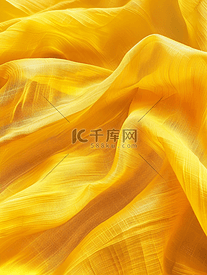 壁纸上棉纺织材料花纹布纹理波亮黄色织物折痕的抽象背景