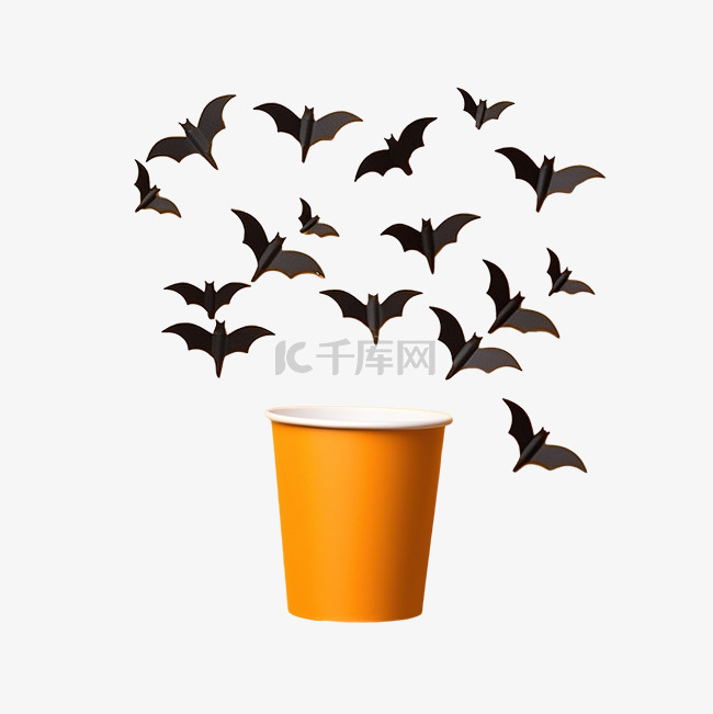 黑蝙蝠从橙色表面纸杯飞出的万圣