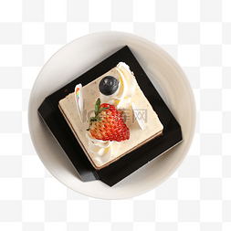 白色盘子食物图片_俯视图白色盘子里的水果蛋糕