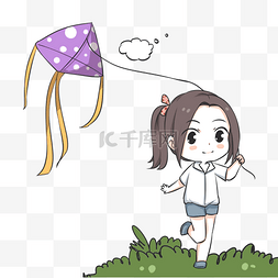 草地上放风筝的小女孩