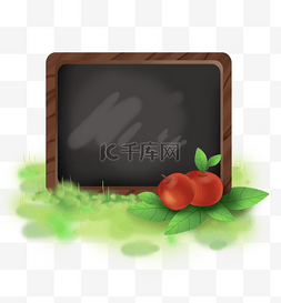草地黑板和两个红苹果