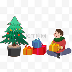 圣诞节圣诞树旁的男孩拆礼物