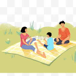 在草丛上野餐的家人