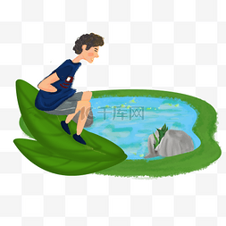 夏季消暑池塘边的小男孩