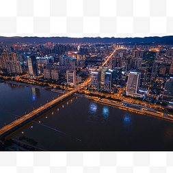 灯光下的城市夜景图片_夕阳下的福州金融街建筑与桥