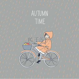 可爱的小女孩骑一辆自行车在秋季