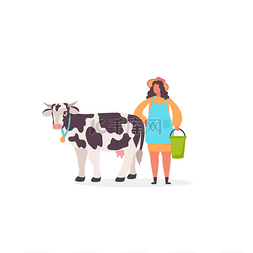 奶牛附近穿着制服的年轻挤奶女农